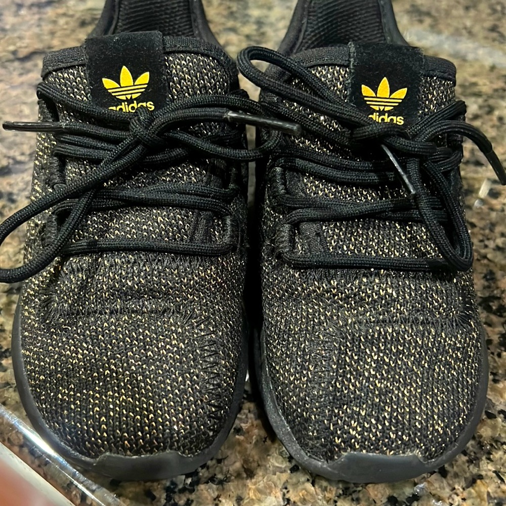 Gently used Adidas baby/toddler girls size 7 black with gold sparkles